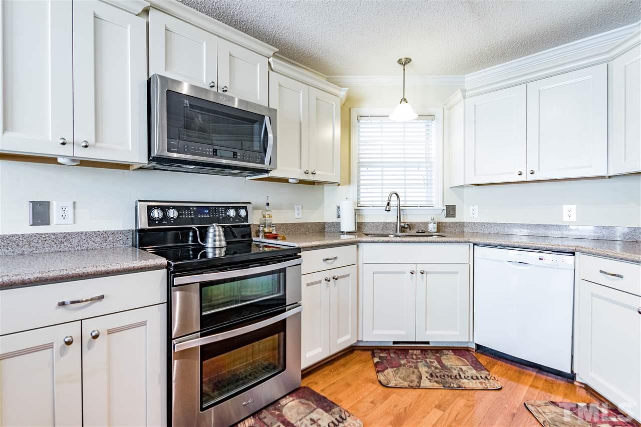4233 Fowler Ridge Drive Raleigh, NC 27616 - Photo 6 of 28 Updated with new soft close cabinetry. Quartz countertops and upgraded appliances