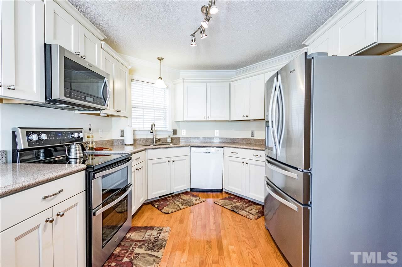4233 Fowler Ridge Drive Raleigh, NC 27616 - Photo 7 of 28 Whirlpool double oven range and Bosch dishwasher.