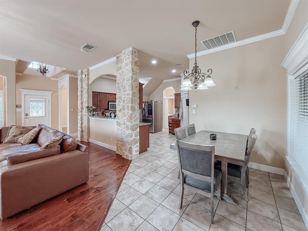 100 Timbershade Drive Red Oak, TX 75154 - Photo 11 of 38 a living room with furniture a chandelier and a chandelier