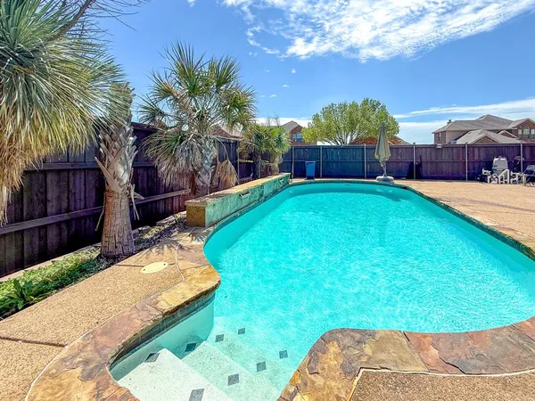 a view of a backyard with a garden