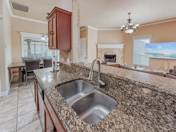 a kitchen with a sink and a stove