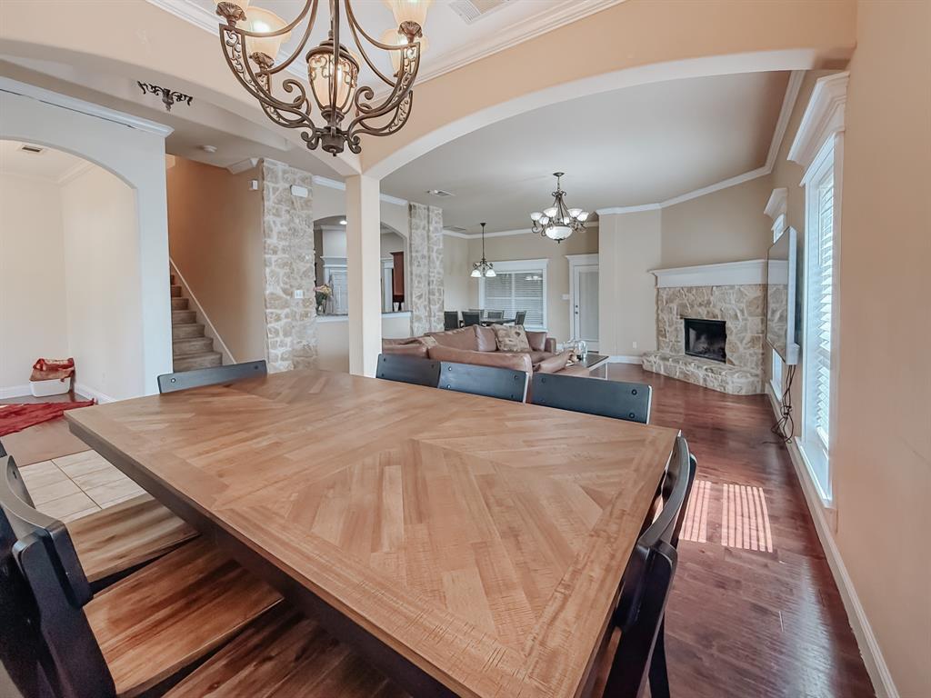 100 Timbershade Drive Red Oak, TX 75154 - Photo 10 of 38 a view of a dining room with furniture window and wooden floor