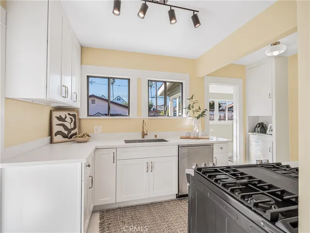 a kitchen with a stove and a sink