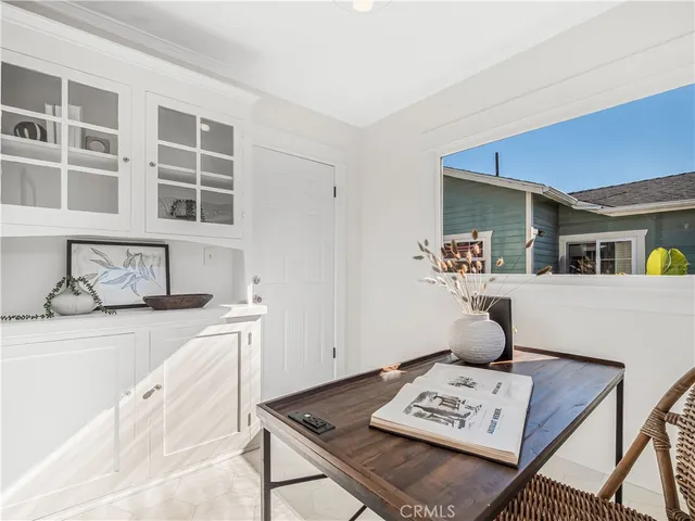 a living room with furniture and next to a window