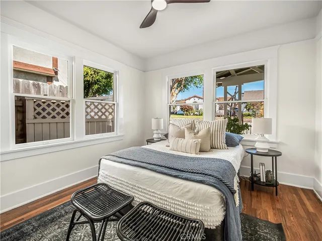 a bedroom with a bed and a table in it