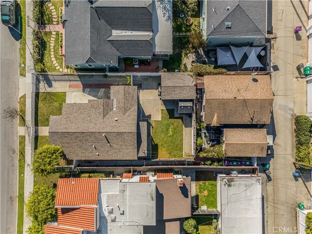 an aerial view of houses with street