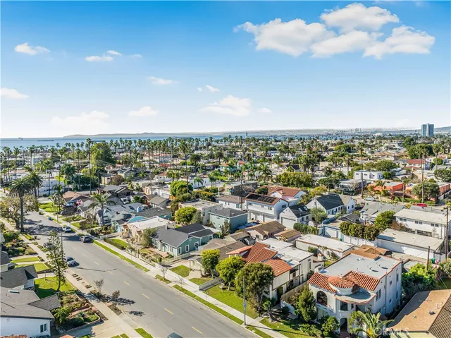 an aerial view of residential houses with city view