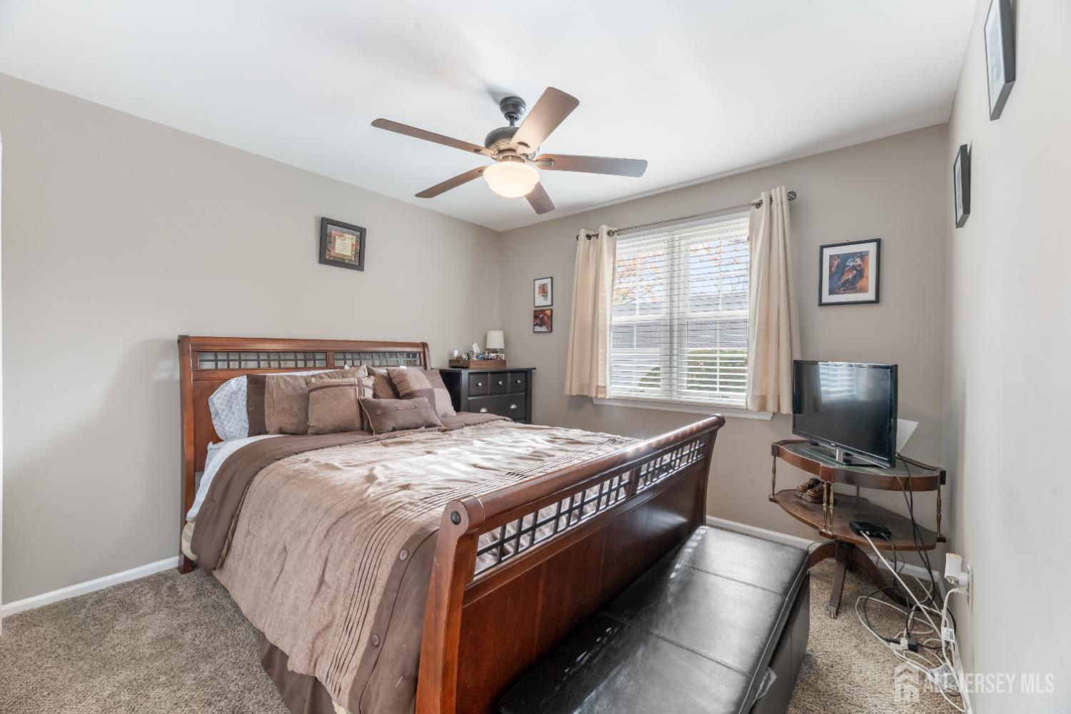 94 Gloucester Way, Unit B Monroe Township, NJ 08831 - Photo 14 of 20 a bedroom with a bed and a window