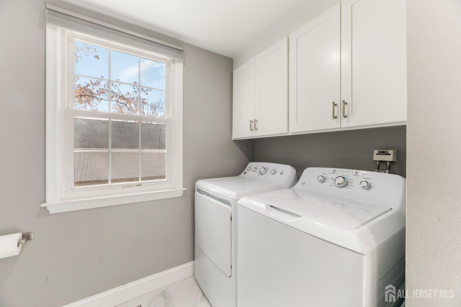 94 Gloucester Way, Unit B Monroe Township, NJ 08831 - Photo 18 of 20 a utility room with dryer and washer