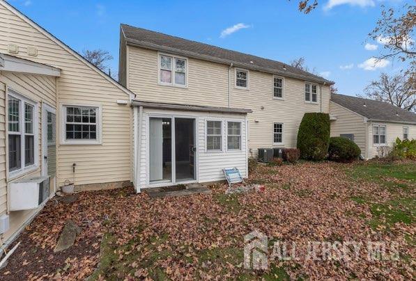 94 Gloucester Way, Unit B Monroe Township, NJ 08831 - Photo 20 of 20 a front view of a house with a garden