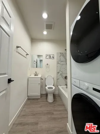 a bathroom with a toilet and a sink