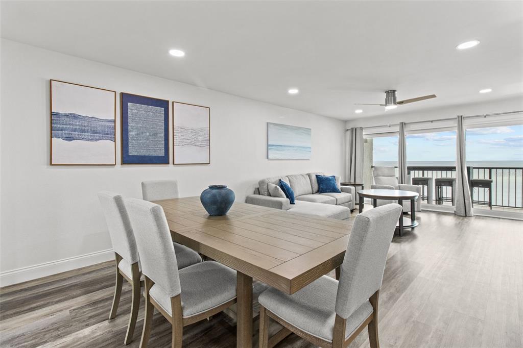 14950 Gulf Boulevard, Unit 503 Madeira Beach, FL 33708 - Photo 11 of 43 a view of a dining room with furniture and wooden floor