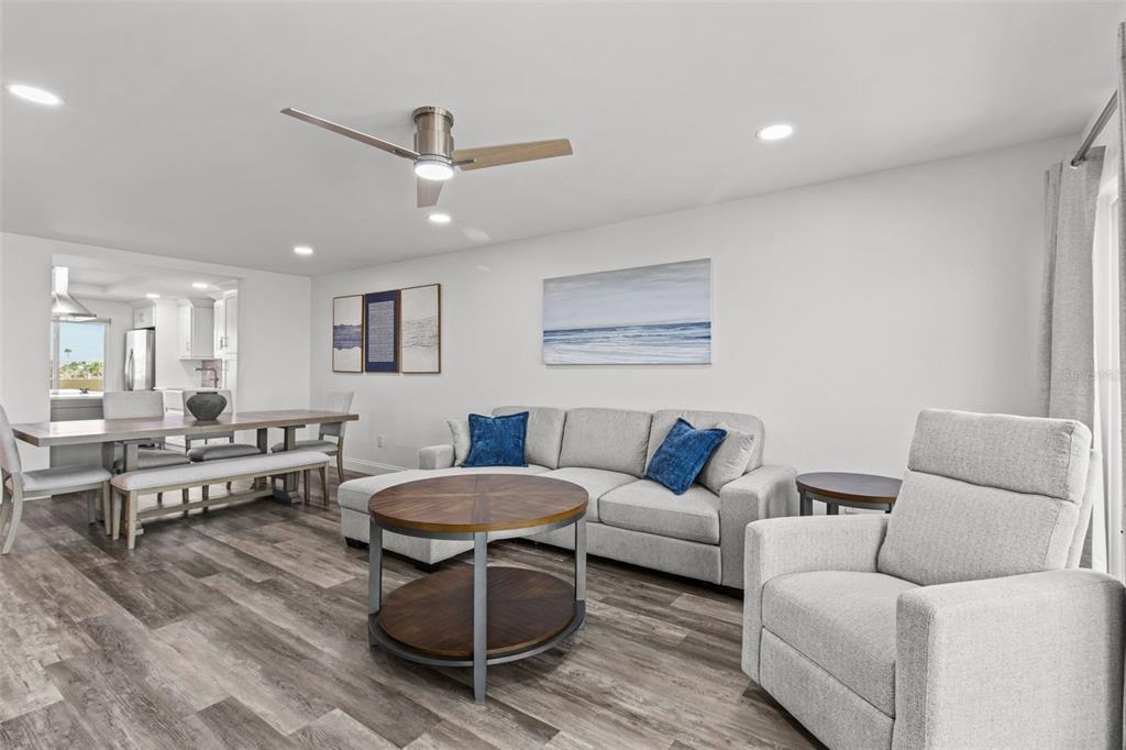 14950 Gulf Boulevard, Unit 503 Madeira Beach, FL 33708 - Photo 15 of 43 a living room with furniture and a wooden floor