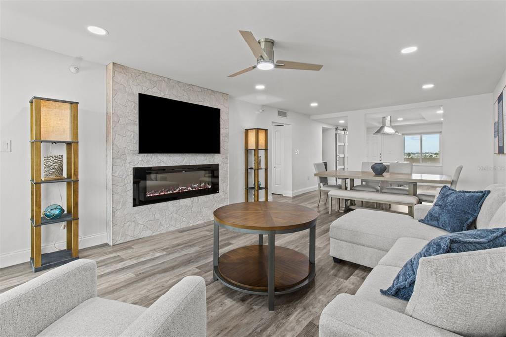 14950 Gulf Boulevard, Unit 503 Madeira Beach, FL 33708 - Photo 16 of 43 a living room with furniture and a flat screen tv