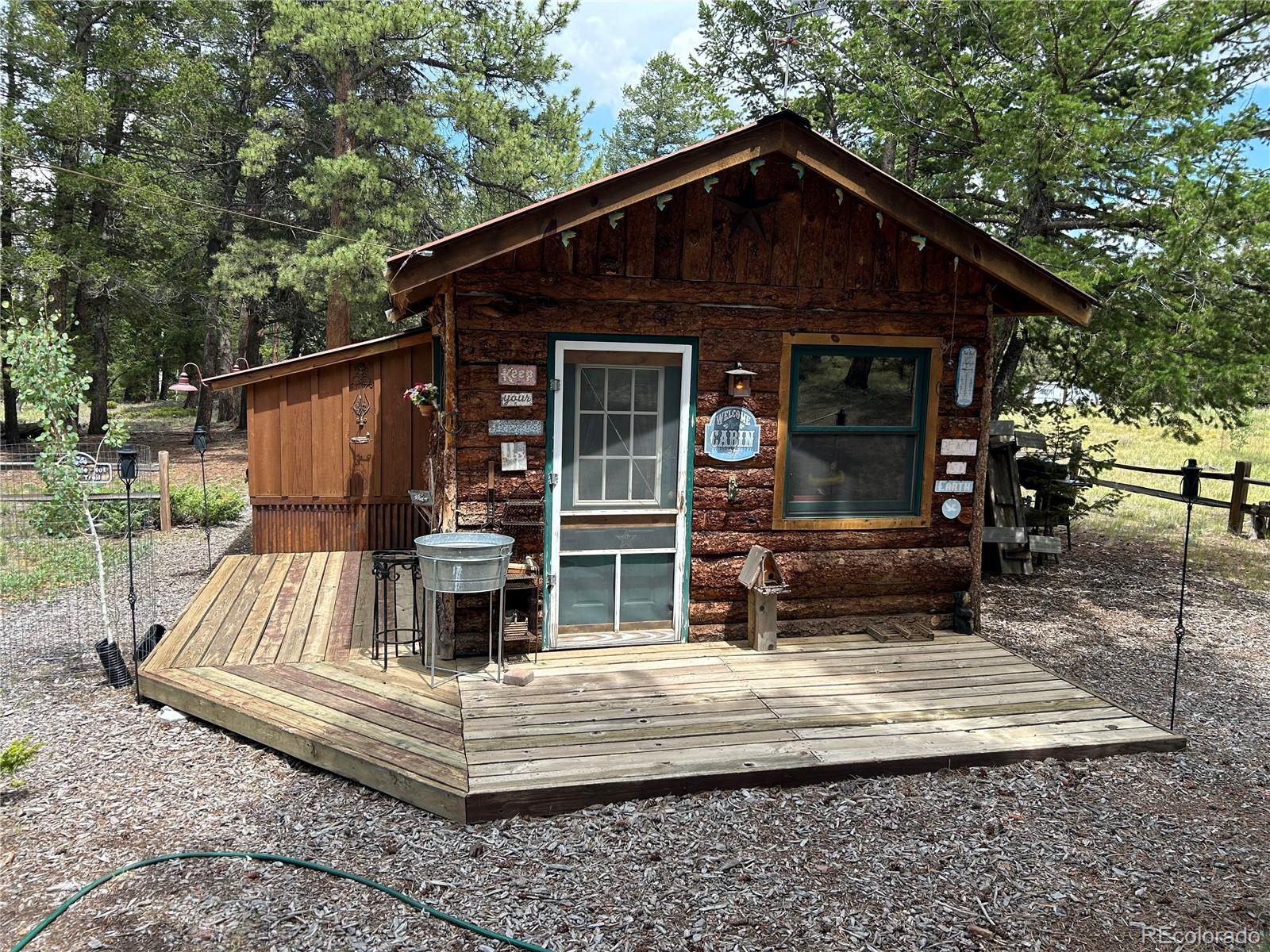 2130 Pitchfork Road Hartsel, CO 80449 - Photo 22 of 30 a view of wooden house with a yard