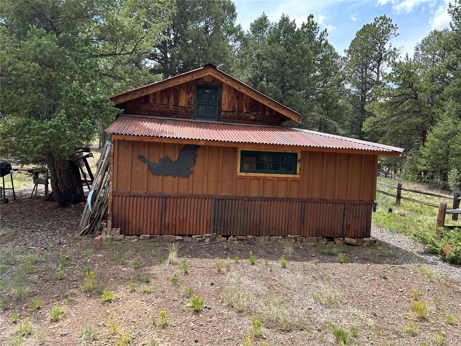 2130 Pitchfork Road Hartsel, CO 80449 - Photo 4 of 30 a front view of a house with a yard