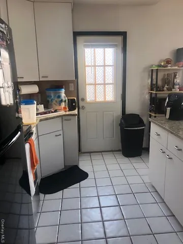 a kitchen with a cabinets and appliances