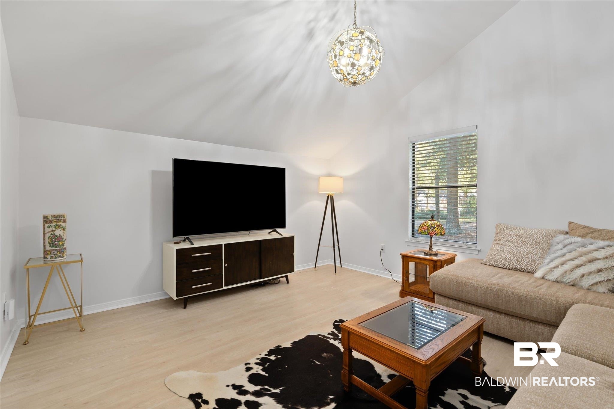 1008 Mcneil Avenue Mobile, AL 36609 - Photo 8 of 20 Living room featuring light hardwood / wood-style flooring, high vaulted ceiling, and a chandelier