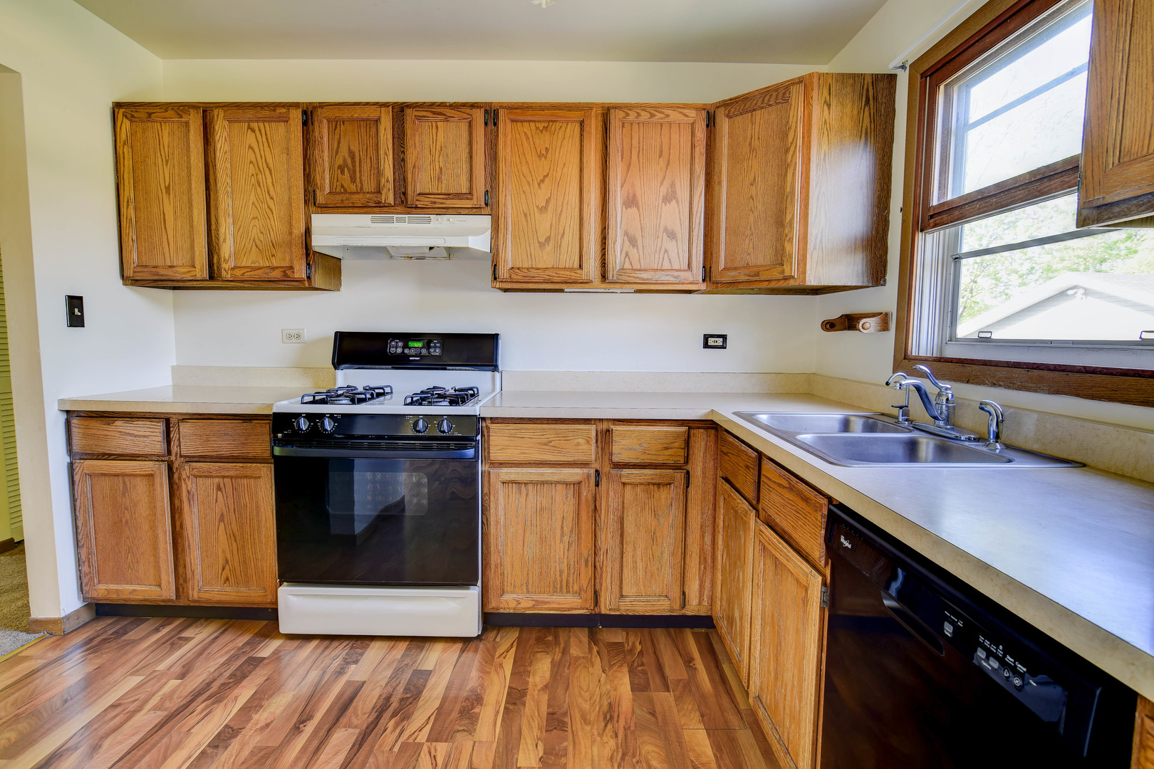 11415 West Edgewood Road Beach Park, IL 60087 - Photo 16 of 29 a kitchen with stainless steel appliances a stove a sink and a microwave