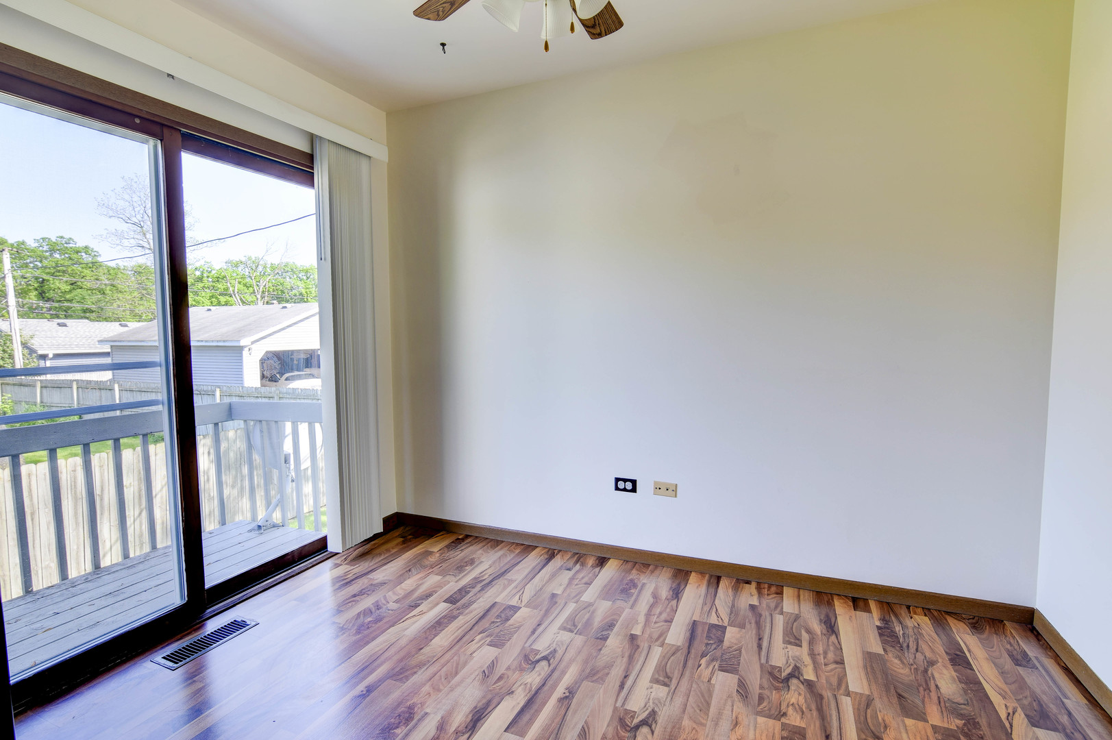 11415 West Edgewood Road Beach Park, IL 60087 - Photo 17 of 29 a view of an empty room with wooden floor and a window