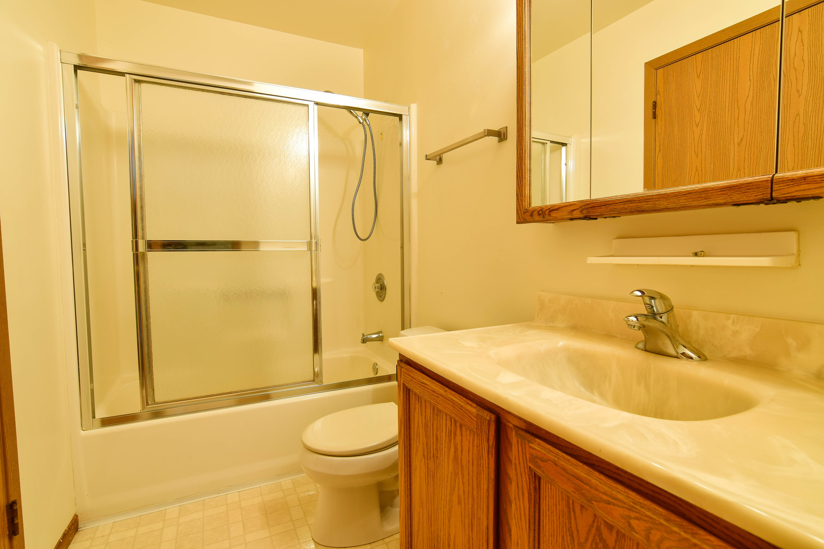 11415 West Edgewood Road Beach Park, IL 60087 - Photo 19 of 29 a bathroom with a sink a toilet and shower