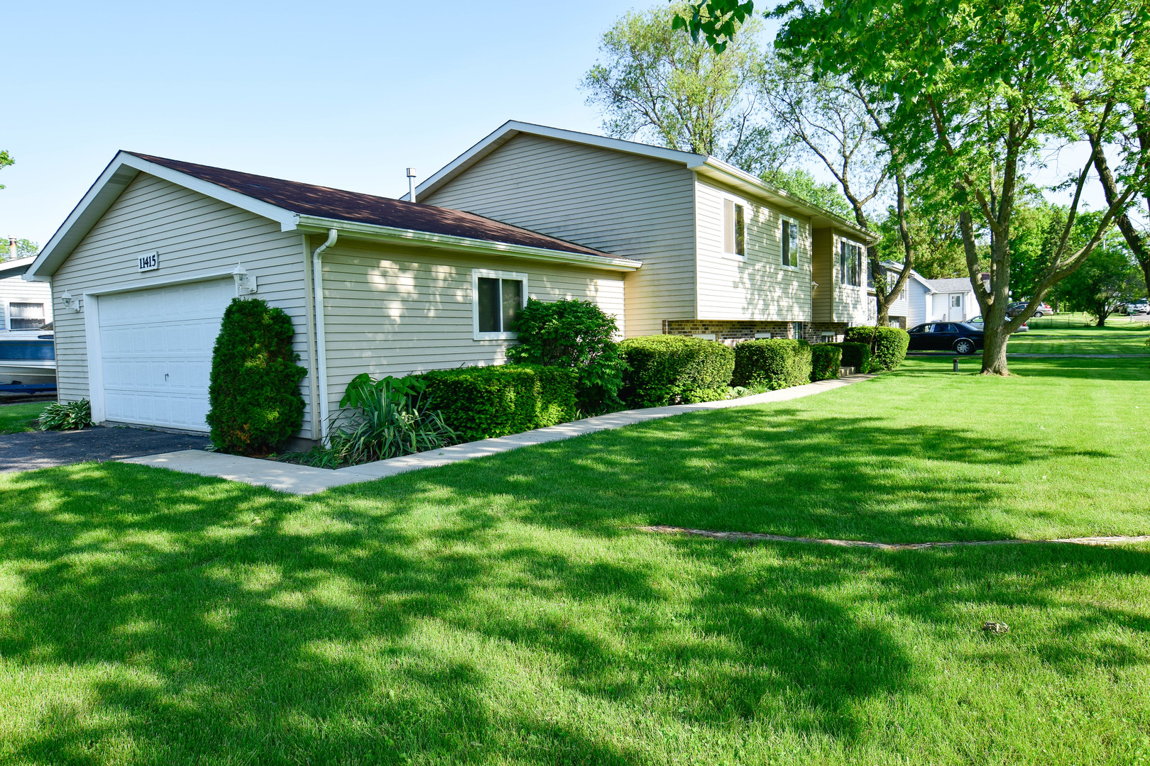 11415 West Edgewood Road Beach Park, IL 60087 - Photo 3 of 29 a view of a house with yard and a garden