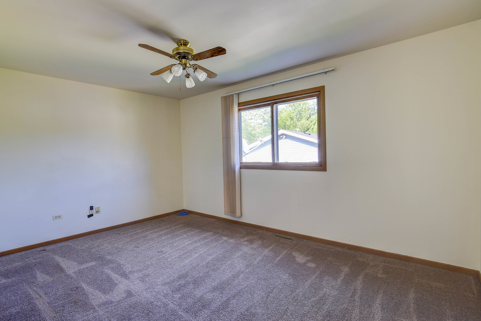 11415 West Edgewood Road Beach Park, IL 60087 - Photo 23 of 29 an empty room with a ceiling fan and window