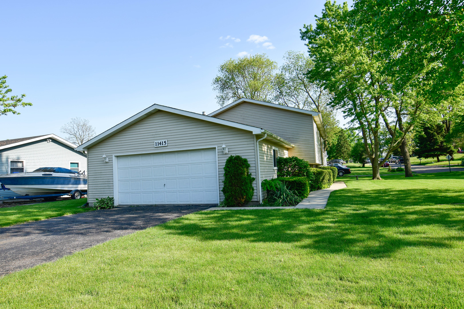 11415 West Edgewood Road Beach Park, IL 60087 - Photo 4 of 29 a front view of house with yard and green space