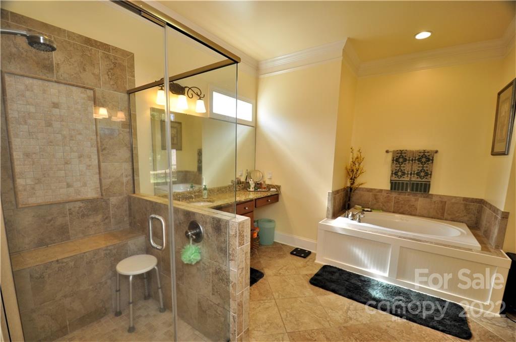 186 Chaska Loop Troutman, NC 28166 - Photo 17 of 48 a bathroom with a sink a toilet and shower