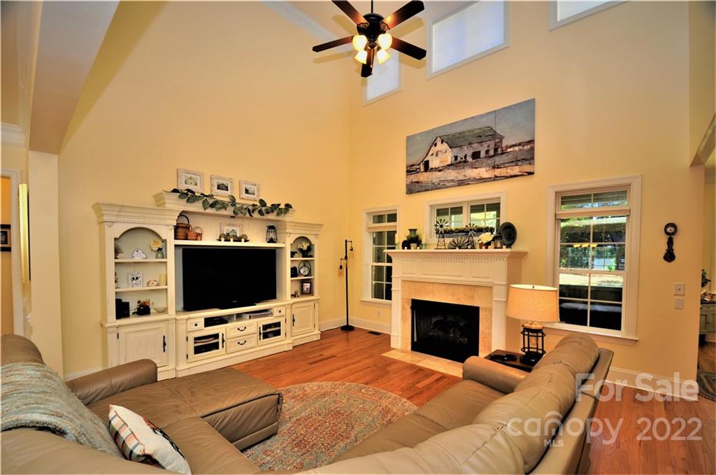 186 Chaska Loop Troutman, NC 28166 - Photo 23 of 48 a living room with furniture and a flat screen tv