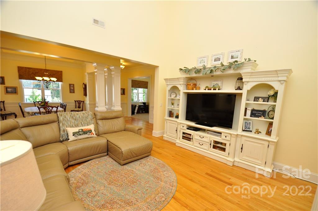 186 Chaska Loop Troutman, NC 28166 - Photo 25 of 48 a living room with furniture and a flat screen tv