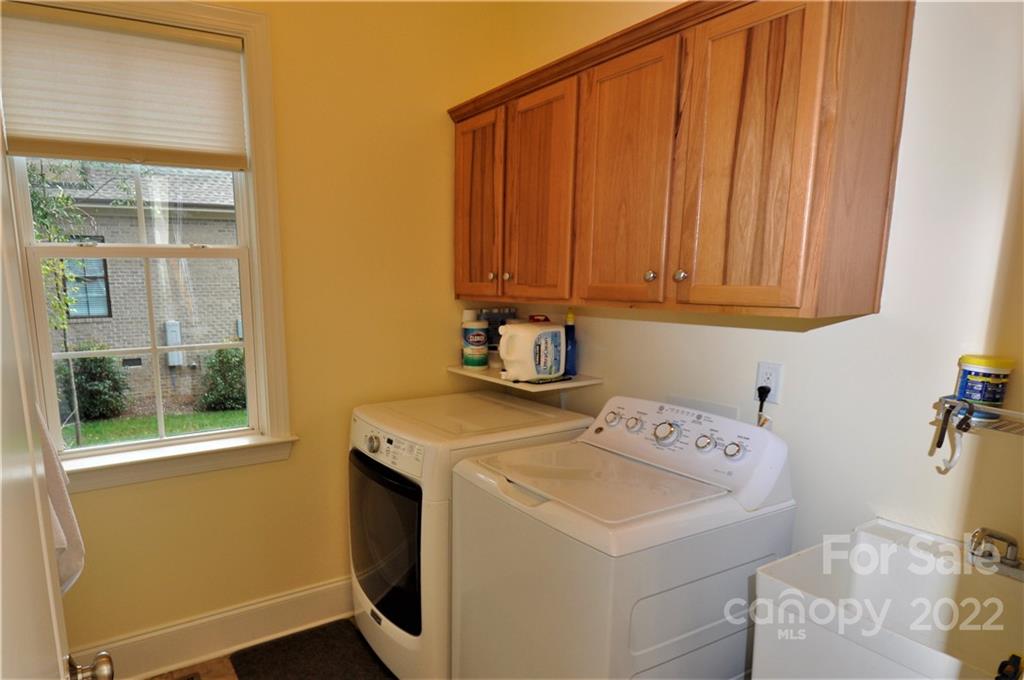 186 Chaska Loop Troutman, NC 28166 - Photo 32 of 48 a utility room with dryer and washer