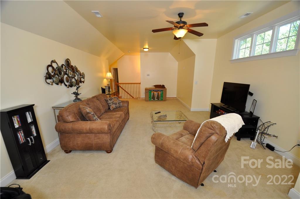 186 Chaska Loop Troutman, NC 28166 - Photo 38 of 48 a living room with furniture