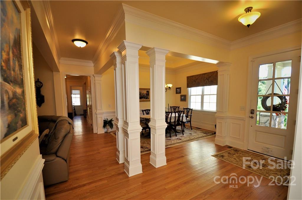 186 Chaska Loop Troutman, NC 28166 - Photo 6 of 48 a living room with furniture and a wooden floor