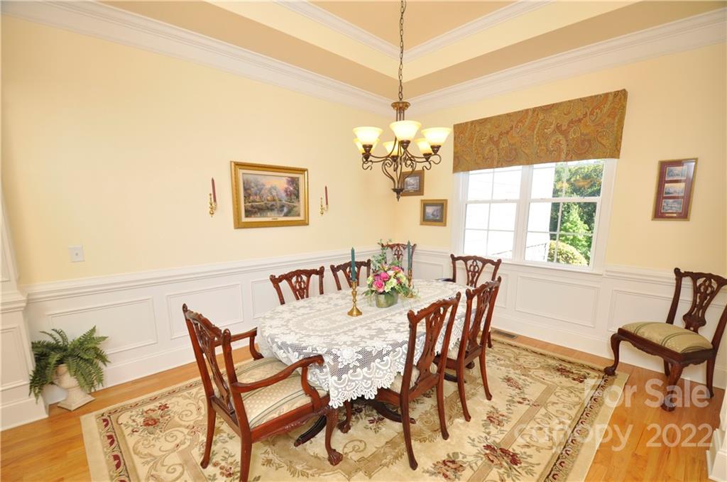 186 Chaska Loop Troutman, NC 28166 - Photo 7 of 48 a view of a dining room with furniture window and outside view