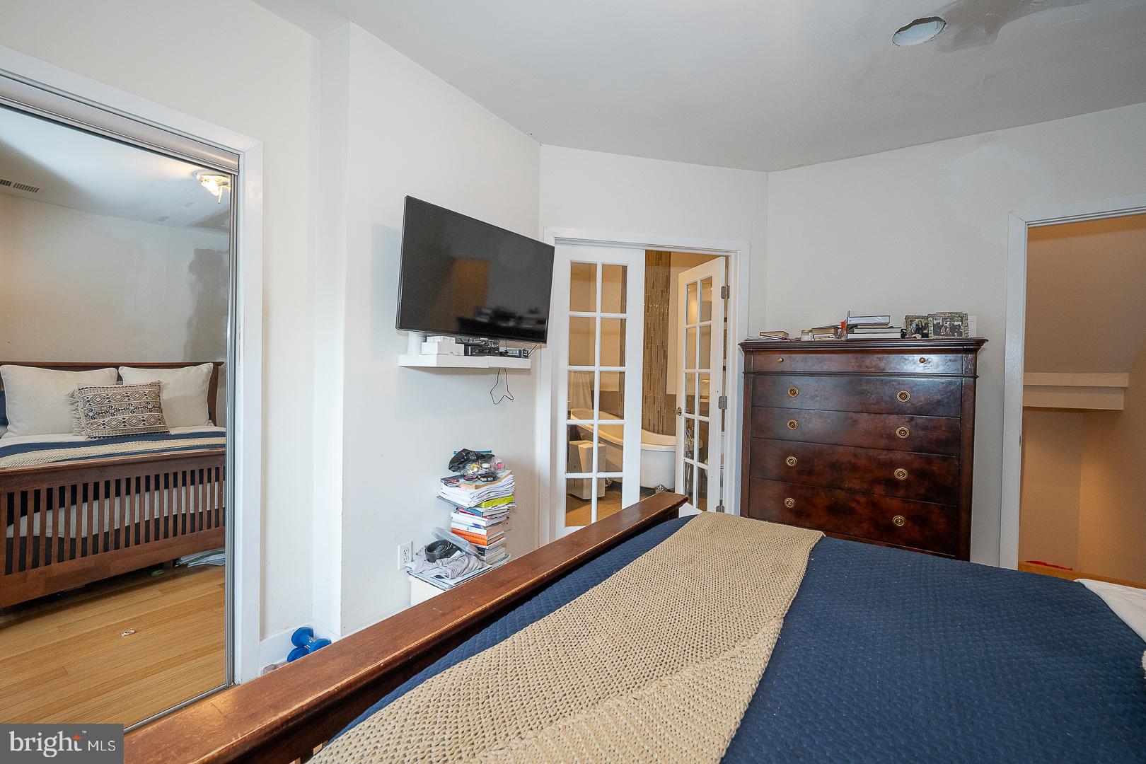 715 Shirley Street, Unit A Philadelphia, PA 19130 - Photo 18 of 24 a living room with furniture and a flat screen tv