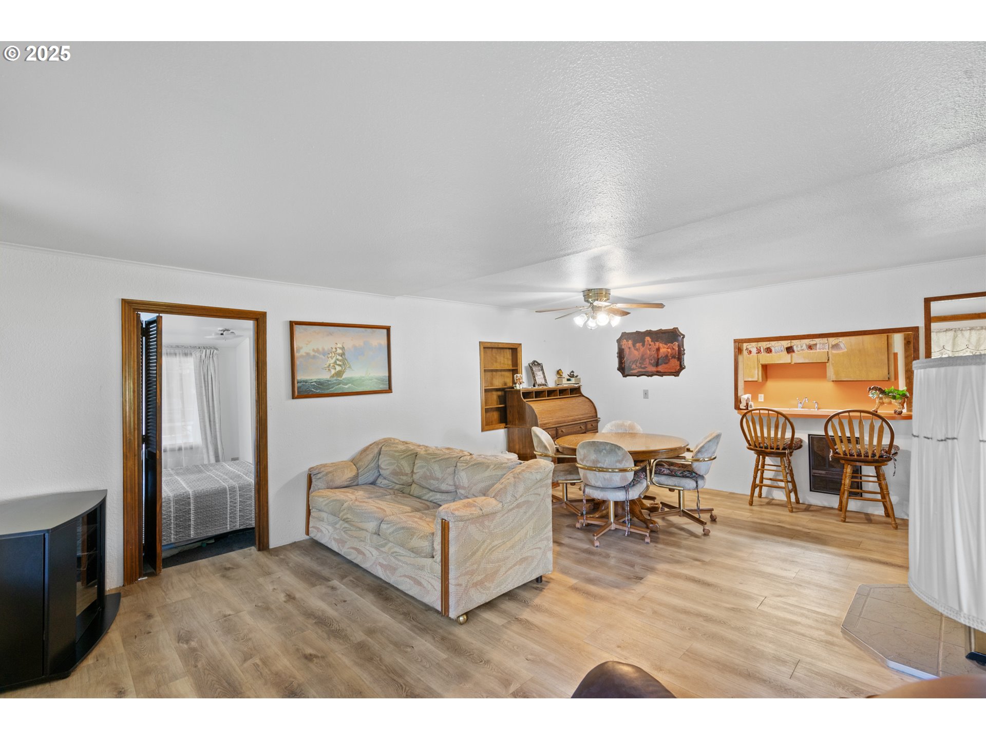 32534 Diagonal Boulevard Hermiston, OR 97838 - Photo 2 of 35 a living room with furniture and a flat screen tv