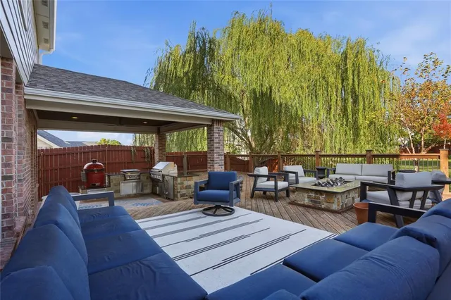 a view of a patio with couches and potted plants