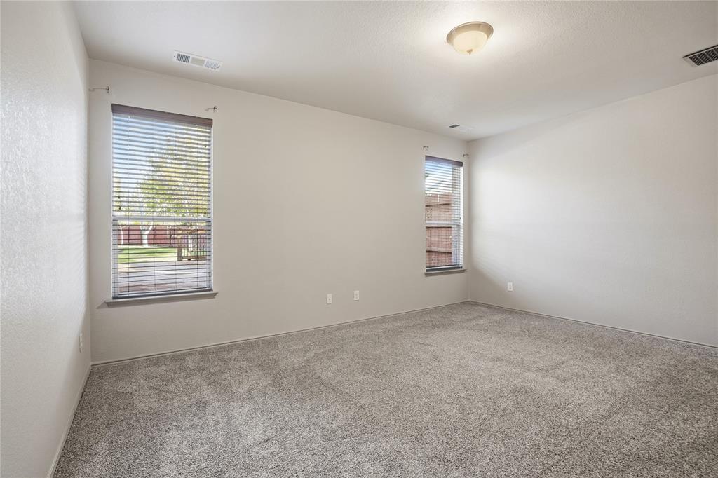 1017 Long Pointe Avenue Fort Worth, TX 76108 - Photo 17 of 28 an empty room with windows