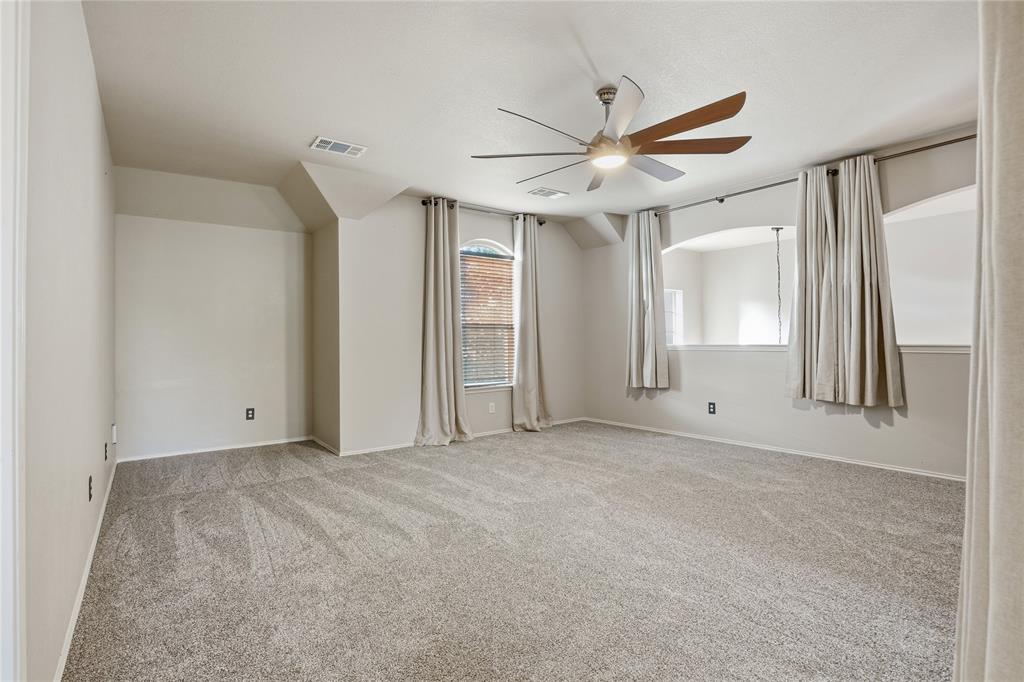 1017 Long Pointe Avenue Fort Worth, TX 76108 - Photo 20 of 28 a view of a livingroom with a ceiling fan and window