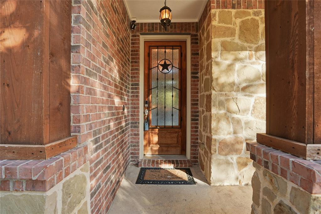 1017 Long Pointe Avenue Fort Worth, TX 76108 - Photo 2 of 28 a view of a wooden door