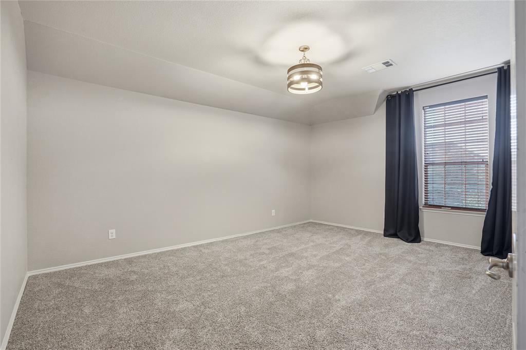 1017 Long Pointe Avenue Fort Worth, TX 76108 - Photo 25 of 28 an empty room with a empty space and windows