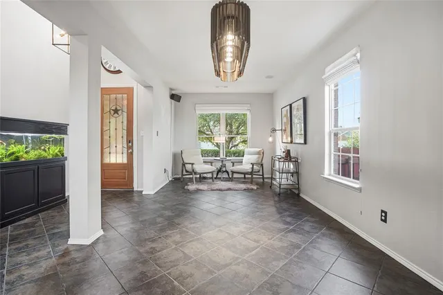 a view of a livingroom with furniture window and front door