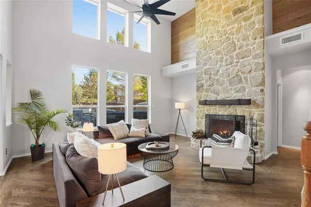 a living room with furniture and a fireplace