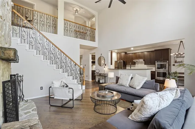 a living room with furniture and a chandelier