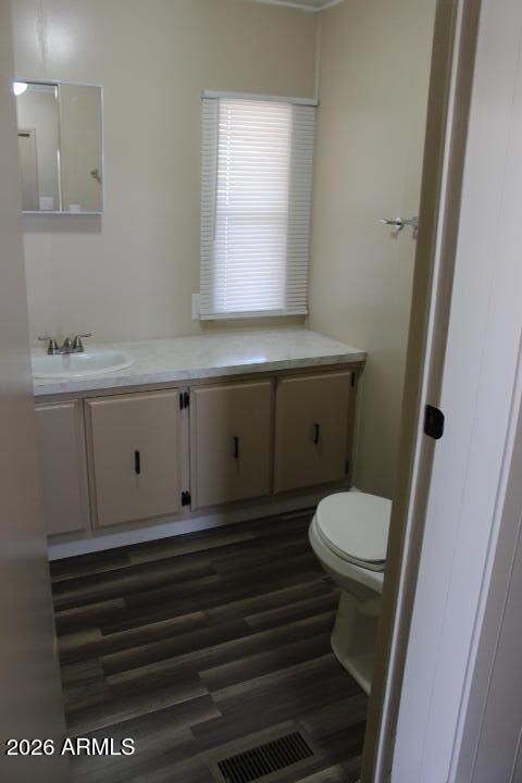 303 South Recker Road, Unit 38 Mesa, AZ 85206 - Photo 17 of 19 a bathroom with a sink a toilet and a window