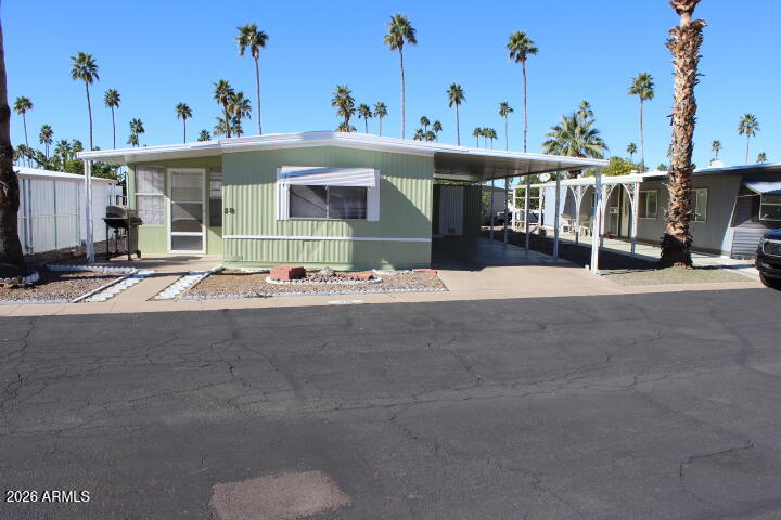 303 South Recker Road, Unit 38 Mesa, AZ 85206 - Photo 19 of 19 a group of cars parked in front of building