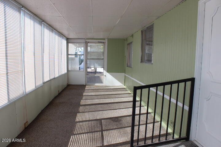 303 South Recker Road, Unit 38 Mesa, AZ 85206 - Photo 3 of 19 a view of a hallway with windows