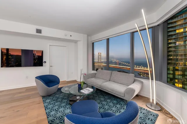 a living room with furniture and a rug