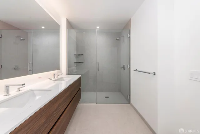 a bathroom with a tub sink and mirror
